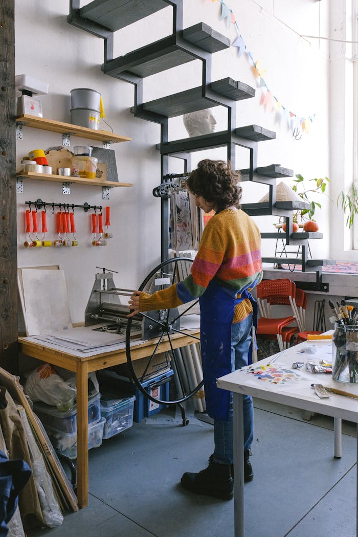 Anonymous woman standing near printing press